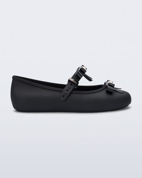 Side view of a black Soft Ballerina Bow with bows and a pearl in the center of each bow