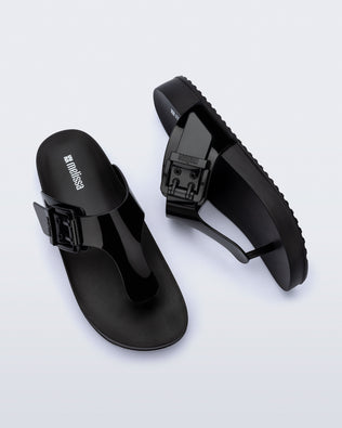 Top and side view of a pair of black Cozy Flip flops