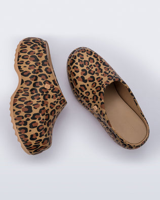 Side and top view of a pair of beige/black leopard print Free Clog Print platforms