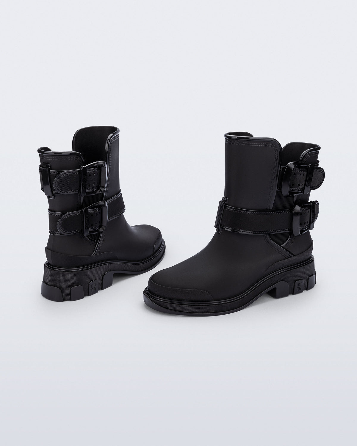 Back and angled view of a pair of black Bang Boots with two side buckles