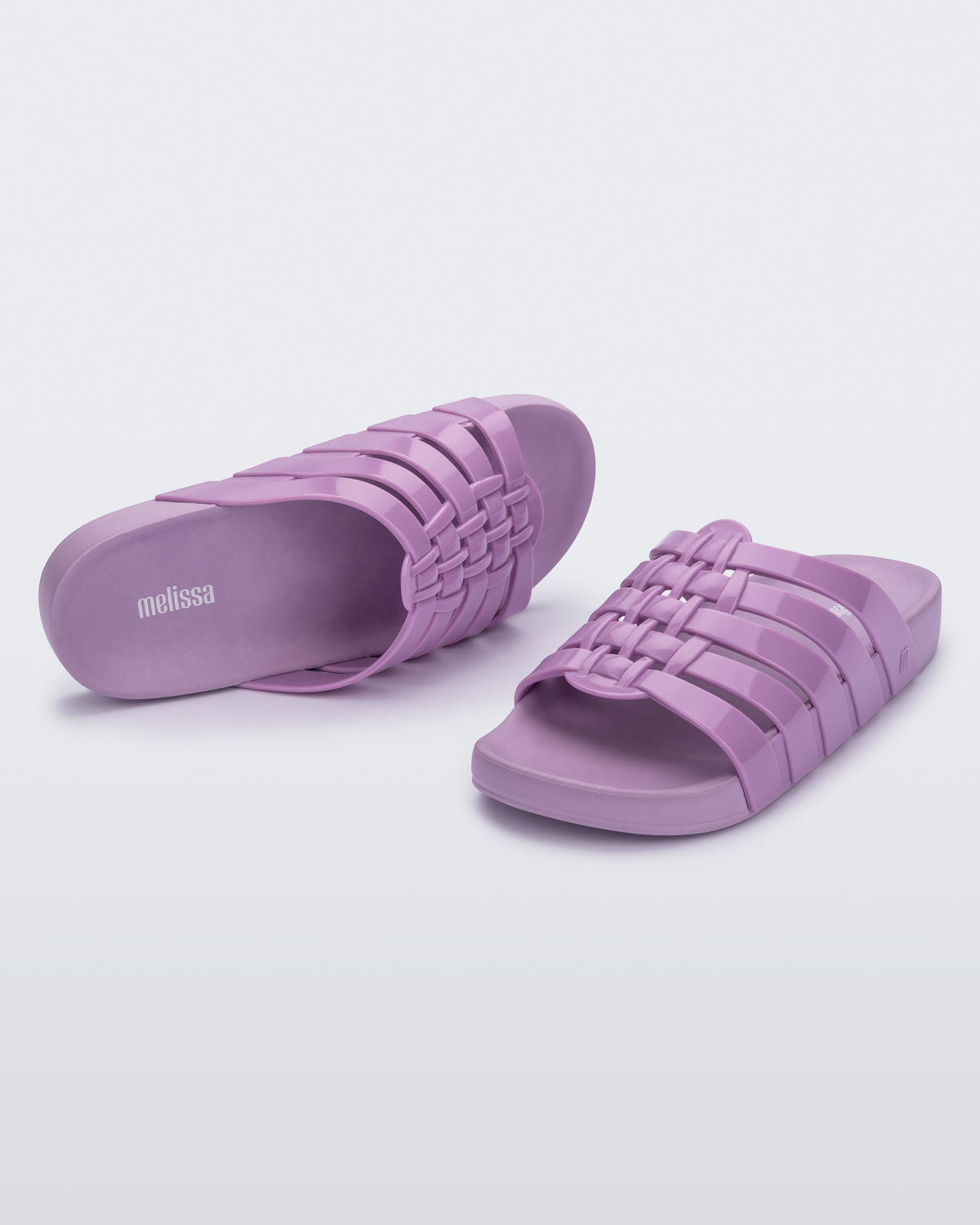 Top and angled view of a pair of lilac Possession Slide