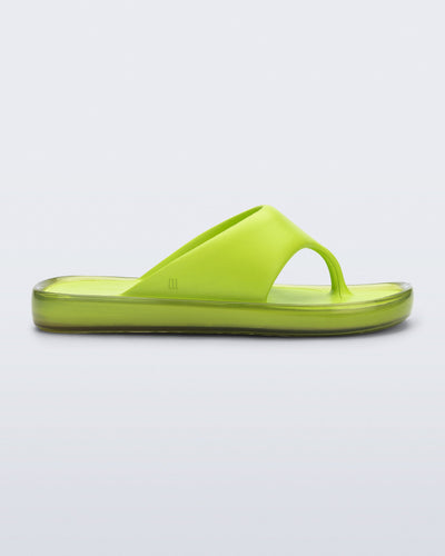 Side view of a green Float flip flop