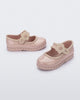 Side and angled view of a pair of beige Hip Ballerina baby flats with strap with flower