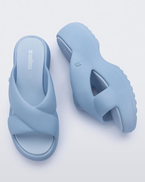 Side and top  view of a pair of blue Free Rise platform slide