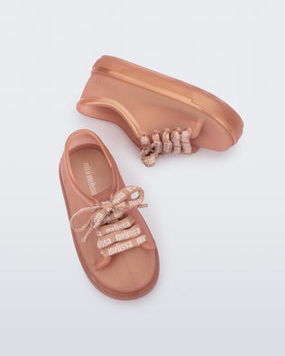 Top and side view of a pair of pearly brown baby Hip M Lover sneakers with laces