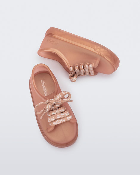 Top and side view of a pair of pearly brown baby Hip M Lover sneakers with laces