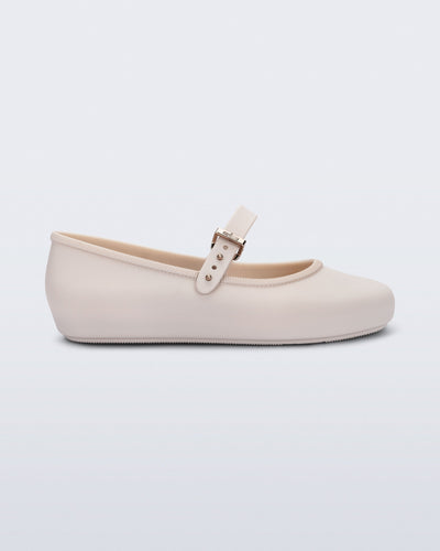 Side view of a beige Soft Ballerina kids flat with strap