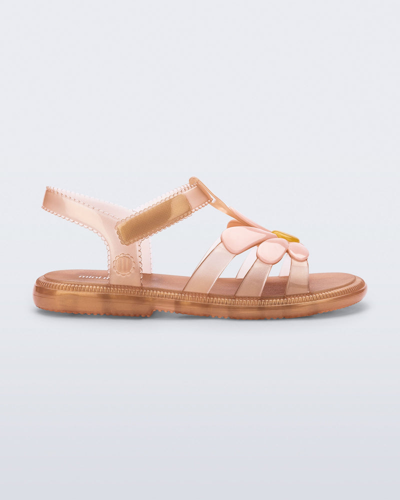 Side view of a kids pearly brown Hip Bloomy sandal