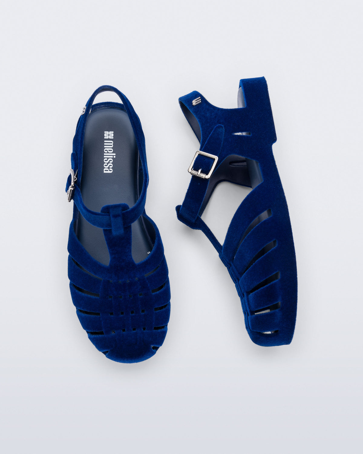 Side and top view of a pair of flocked blue Possession Velvet fisherman sandals