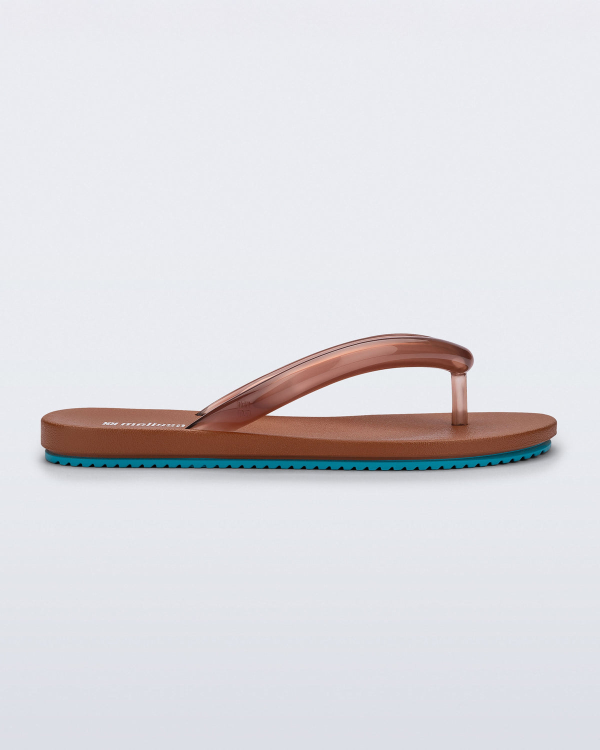 Side view of a brown Flip Flop Airflow sandal with a clear brown strap and blue bottom