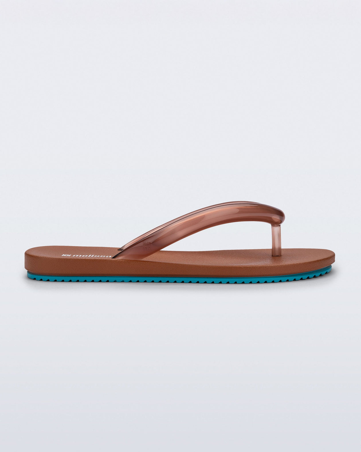 Side view of a brown Flip Flop Airflow sandal with a clear brown strap and blue bottom