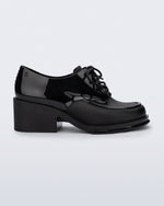 Side view of a black Tailor loafer with laces
