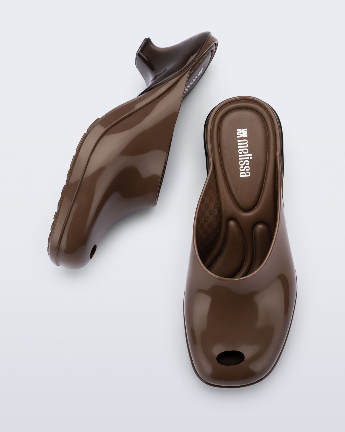 Top and side view of a pair of brown Gaia kitten heels with peep toe
