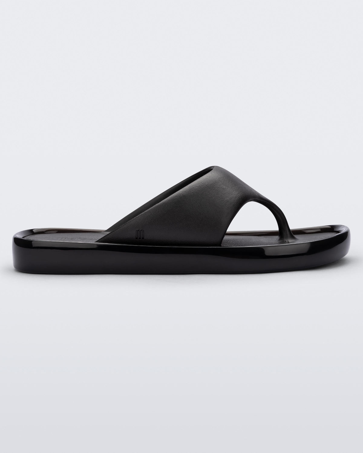 Side view of a black Float flip flop