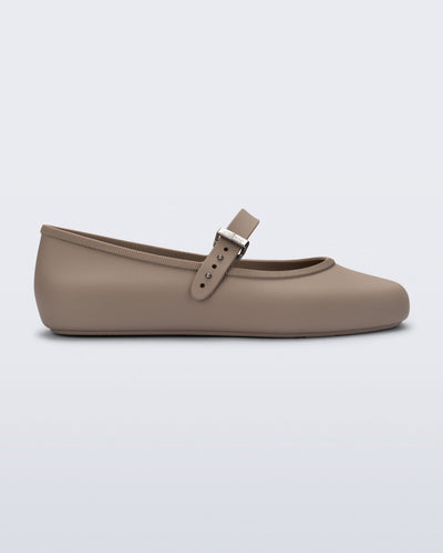 Side view of a dark beige  Soft Ballerina flat with top buckle strap