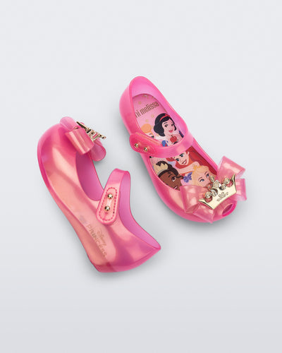 Angled and side view of a pair of pearly pink baby Ultragirl Princess flats
