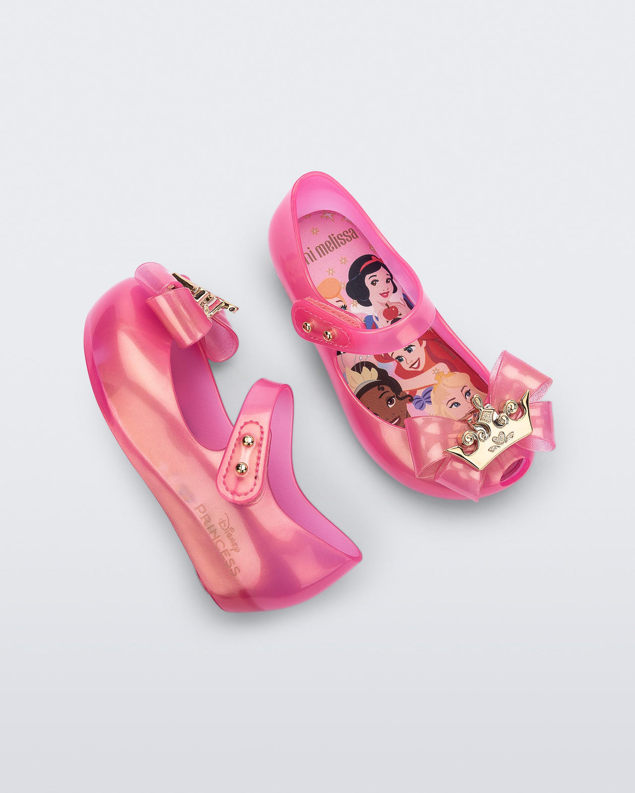 Angled and side view of a pair of pearly pink baby Ultragirl Princess flats