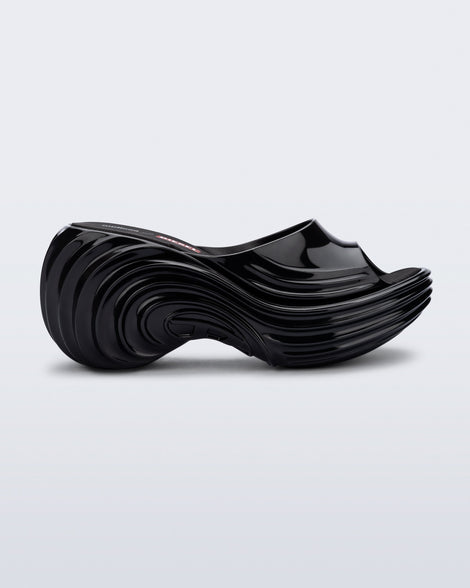 Side view of a black Platforms + Diesel slides