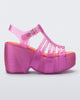 Side view of a pink Station 79 platform heel with ankle strap