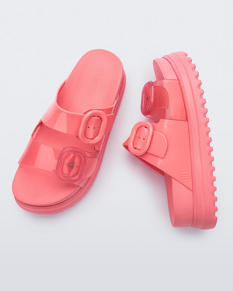 Top and side view of a pair of pink Cozy Platform slides