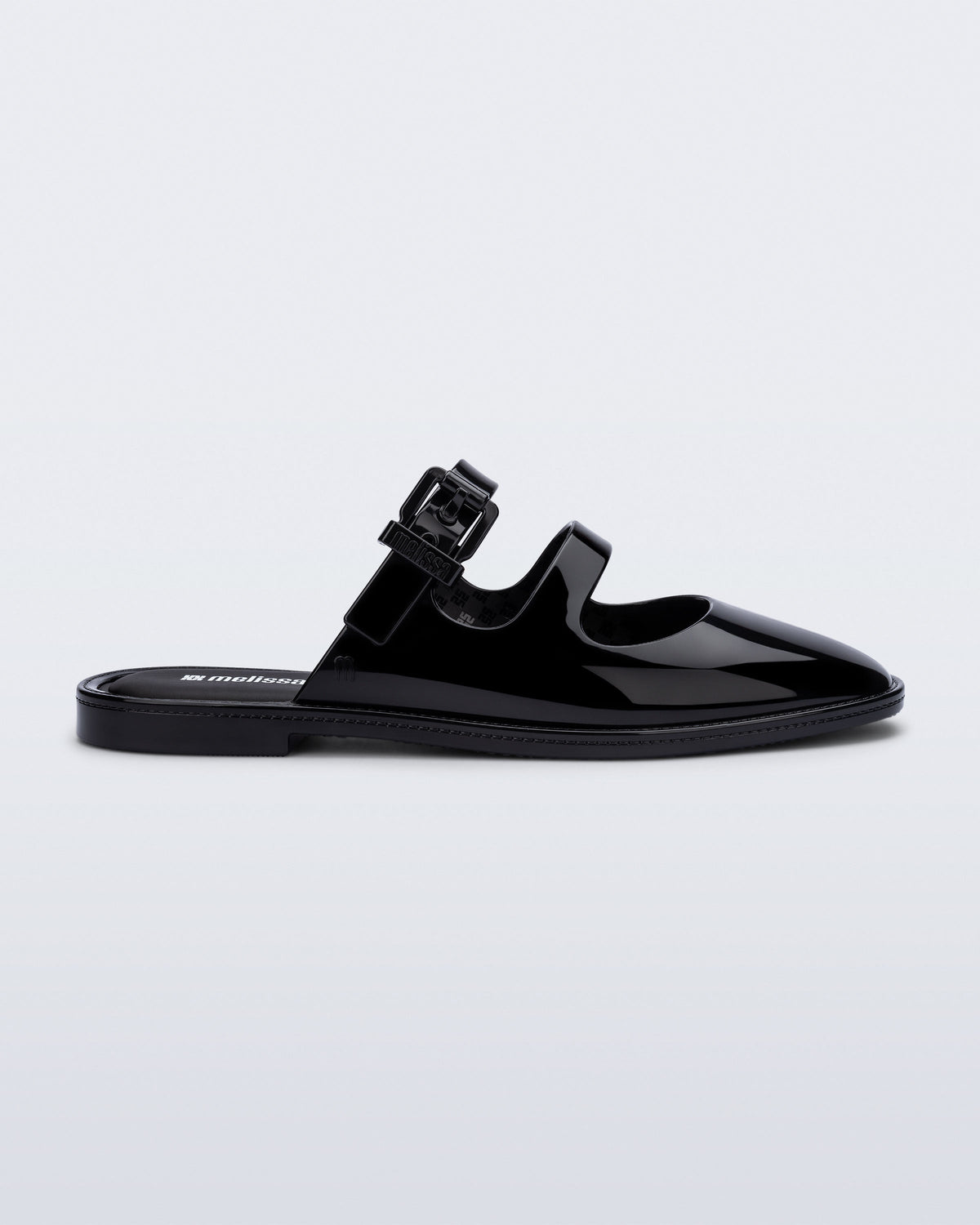 Side view of a black Anastasia mule slide with upper straps