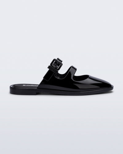 Side view of a black Anastasia mule slide with upper straps