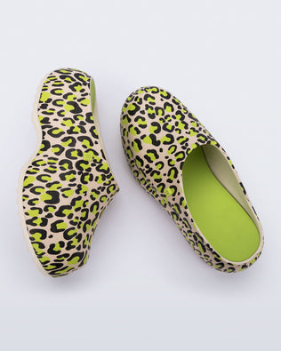 Side and top view of a pair of beige/green leopard print Free Clog Print platforms