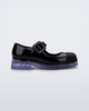 Side view of a black with clear sole June kids mary jane with matte toe cap