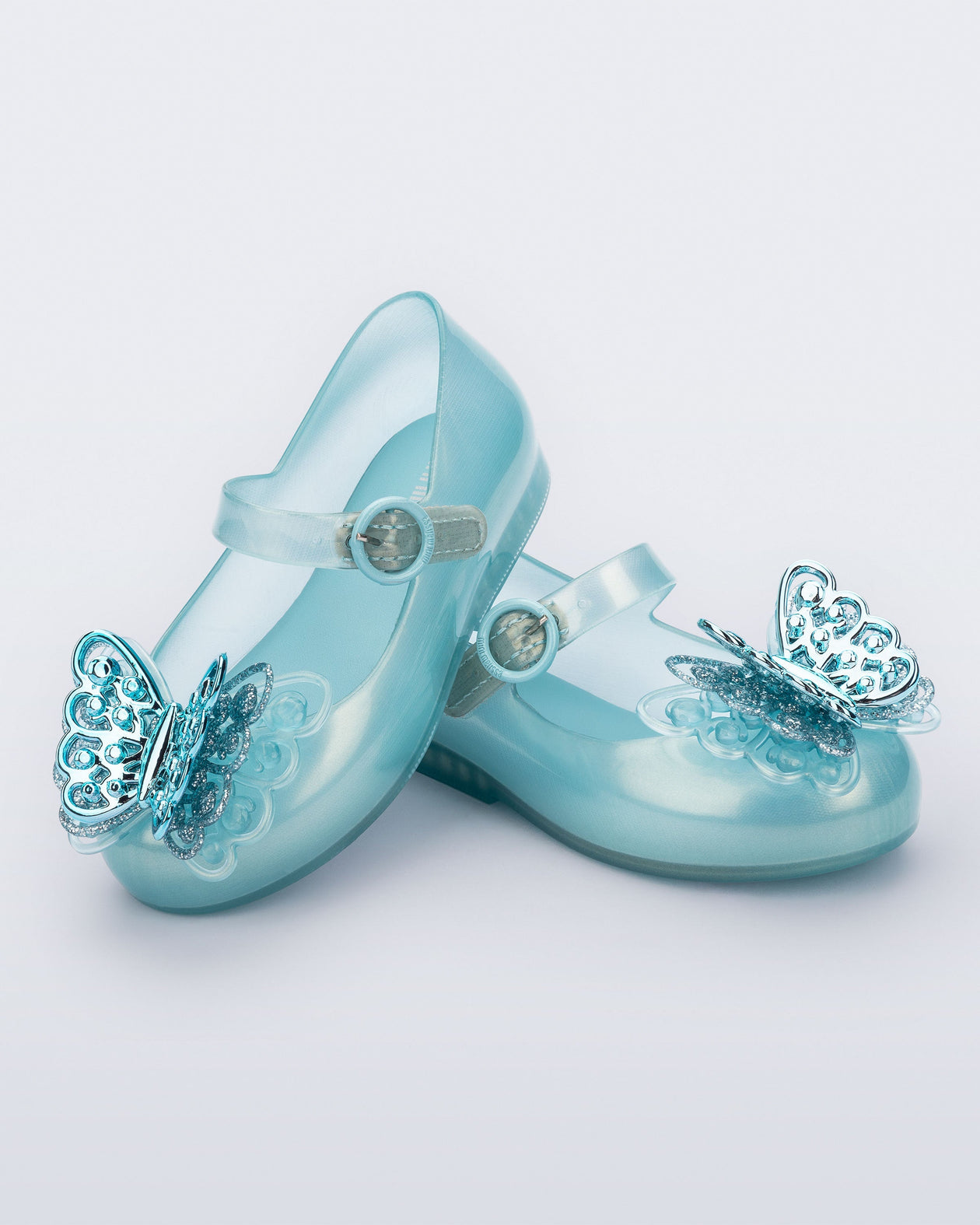 Angled view of a pair of blue Sweet Love Butterfly baby flats
