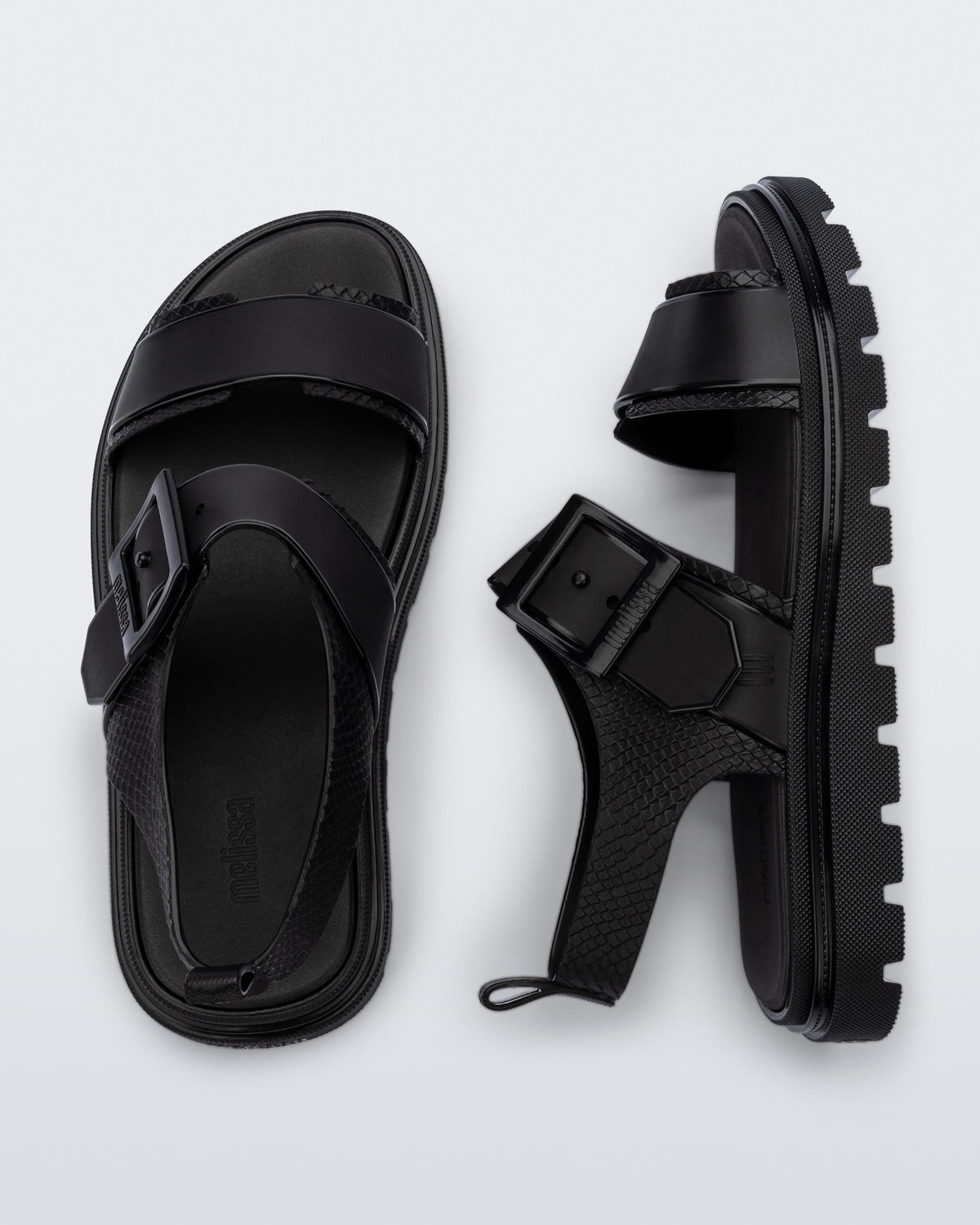 Top and side view of a pair of black Connection Papete sandals
