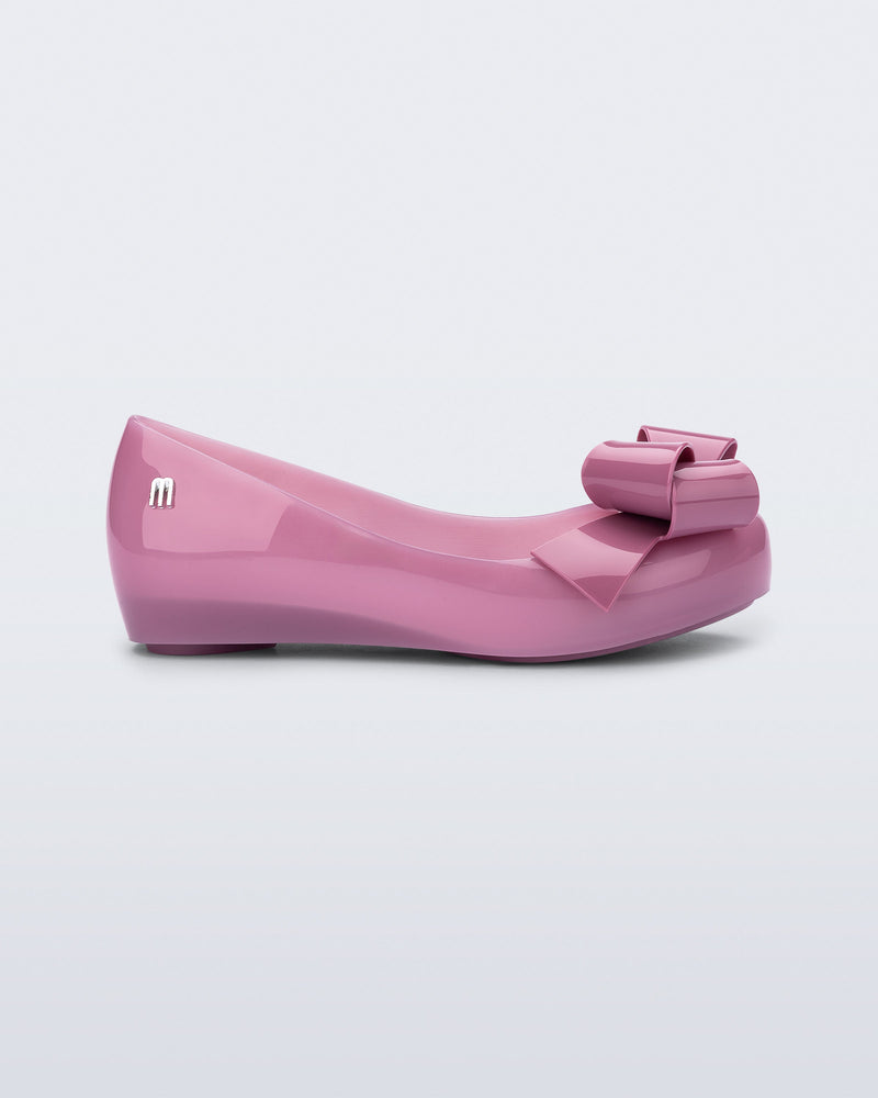 Side view of a lilac Ultragirl Classy baby ballerina with lilac bow.