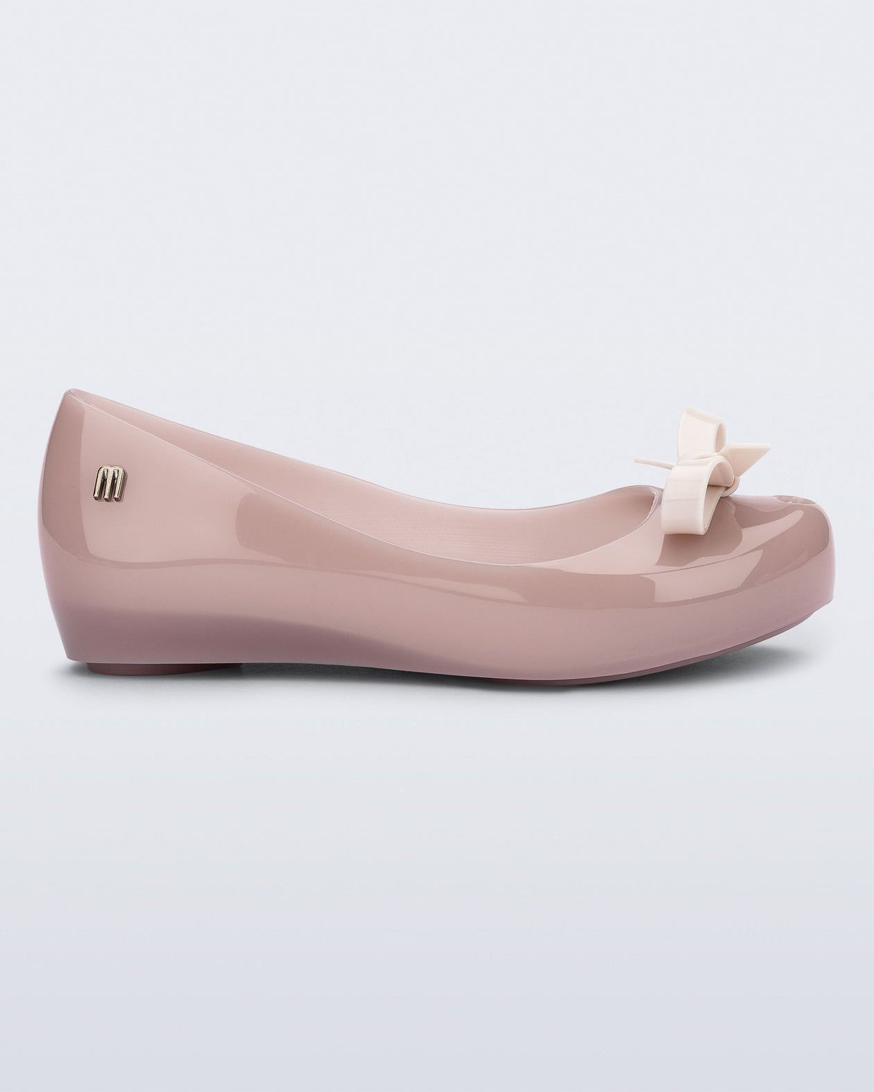 Side view of a pink kids Ultragirl Bow flat