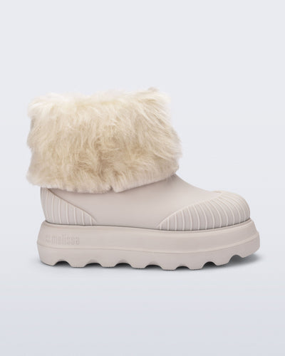 Side view of a beige Warm Boot with fuzzy cuff and inside
