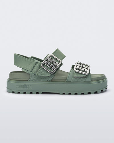 Side view of a green Towny sandal with straps and silver buckle