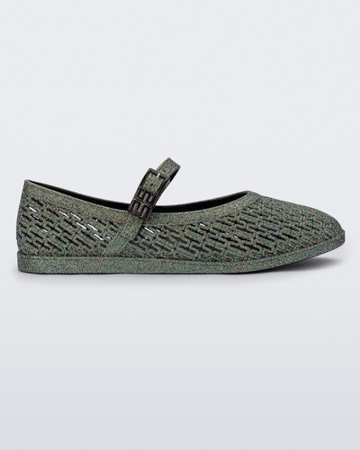 Side view of a dark silver glitter Harper flat with strap