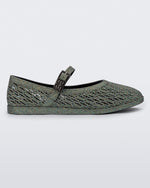 Side view of a dark silver glitter Harper flat with strap