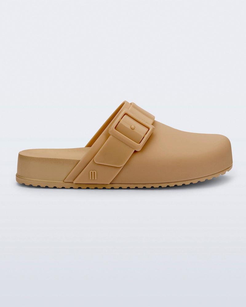 Side view of a dark beige Cozy Clog