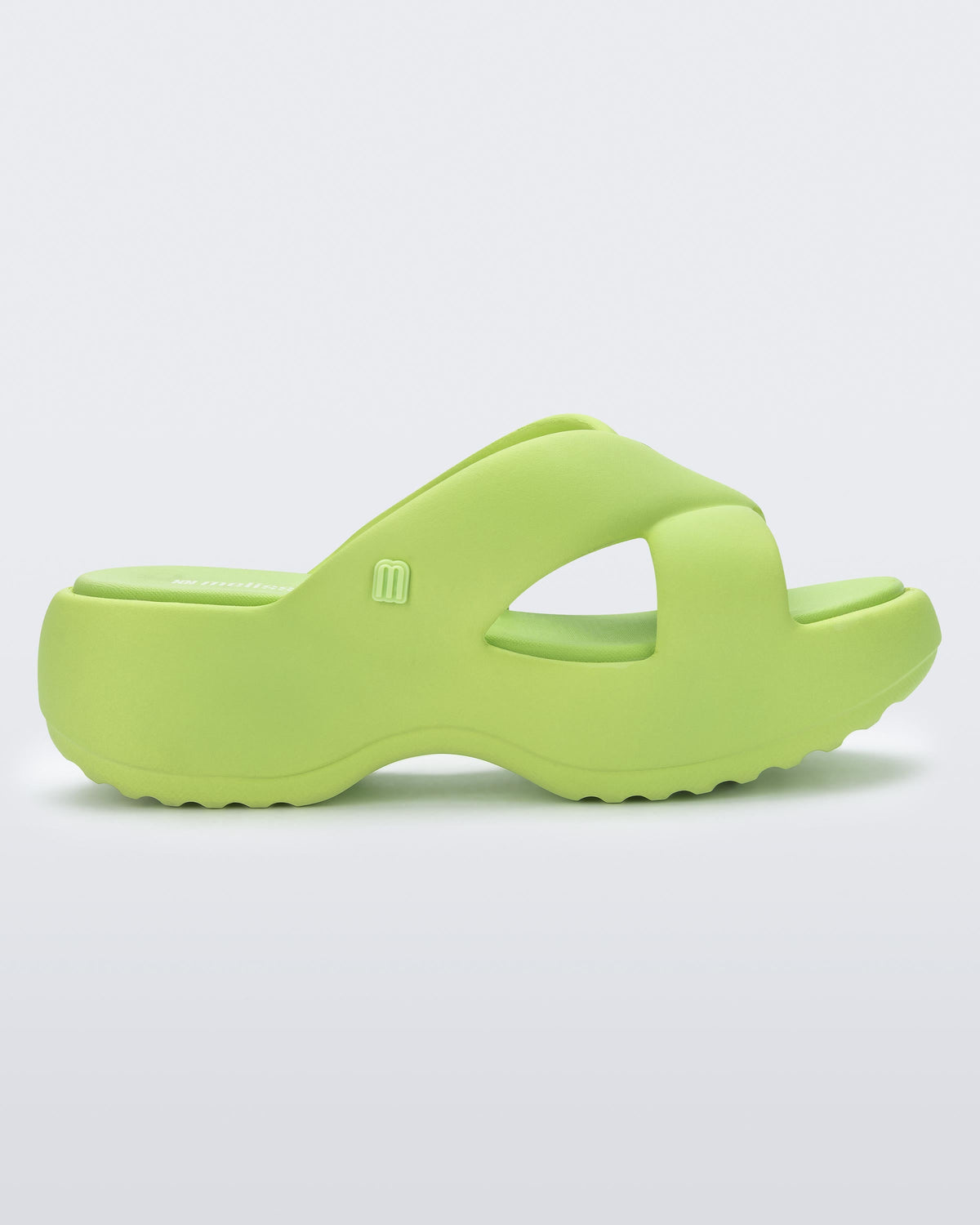 Side view of a green Free Rise platform slide sandal