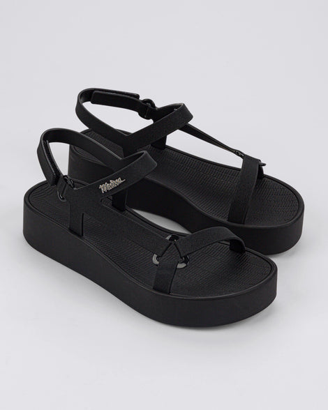 Angled view of a pair of black Sun Downtown Platform sandals