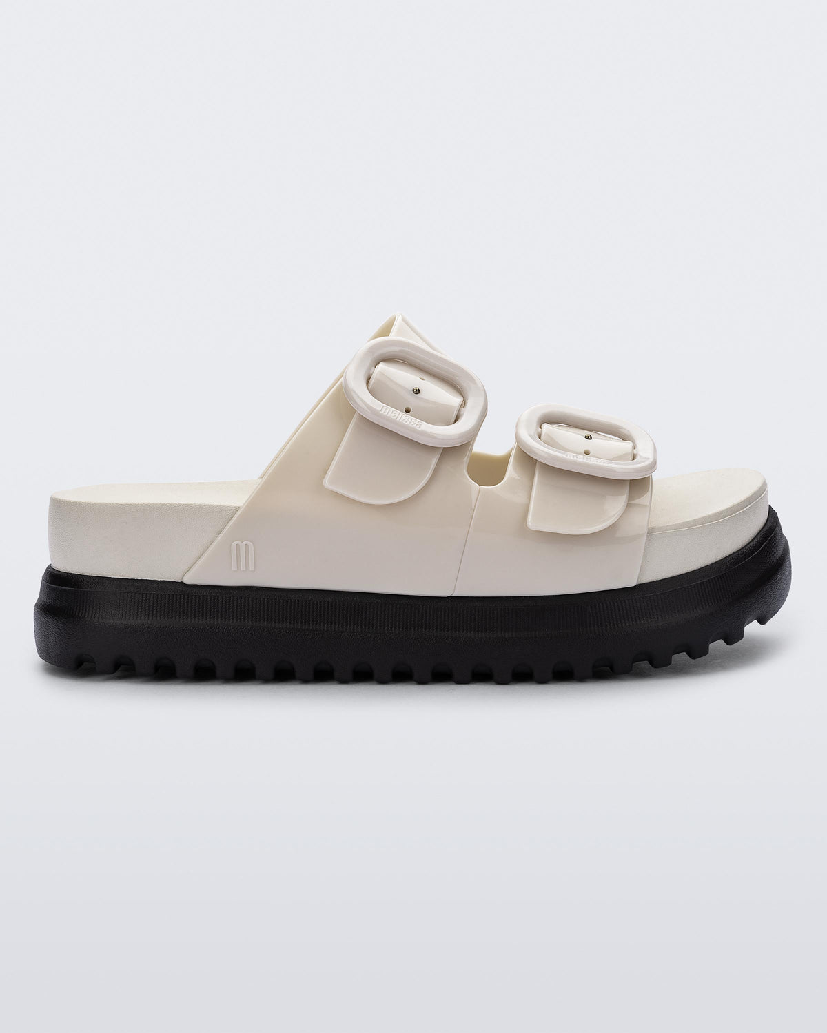 Side view of a beige Cozy Platform slide
