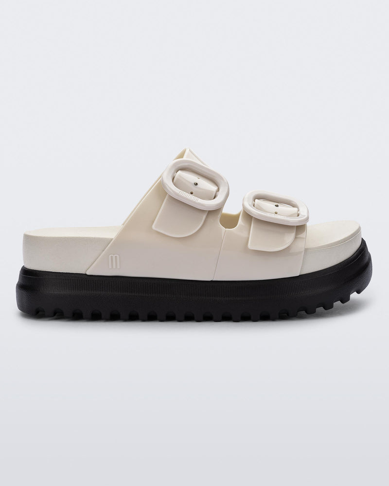 Side view of a beige Cozy Platform slide