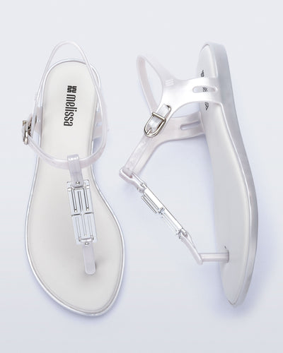 Side and top view of a pair of pearly white Solar M Chic sandals
