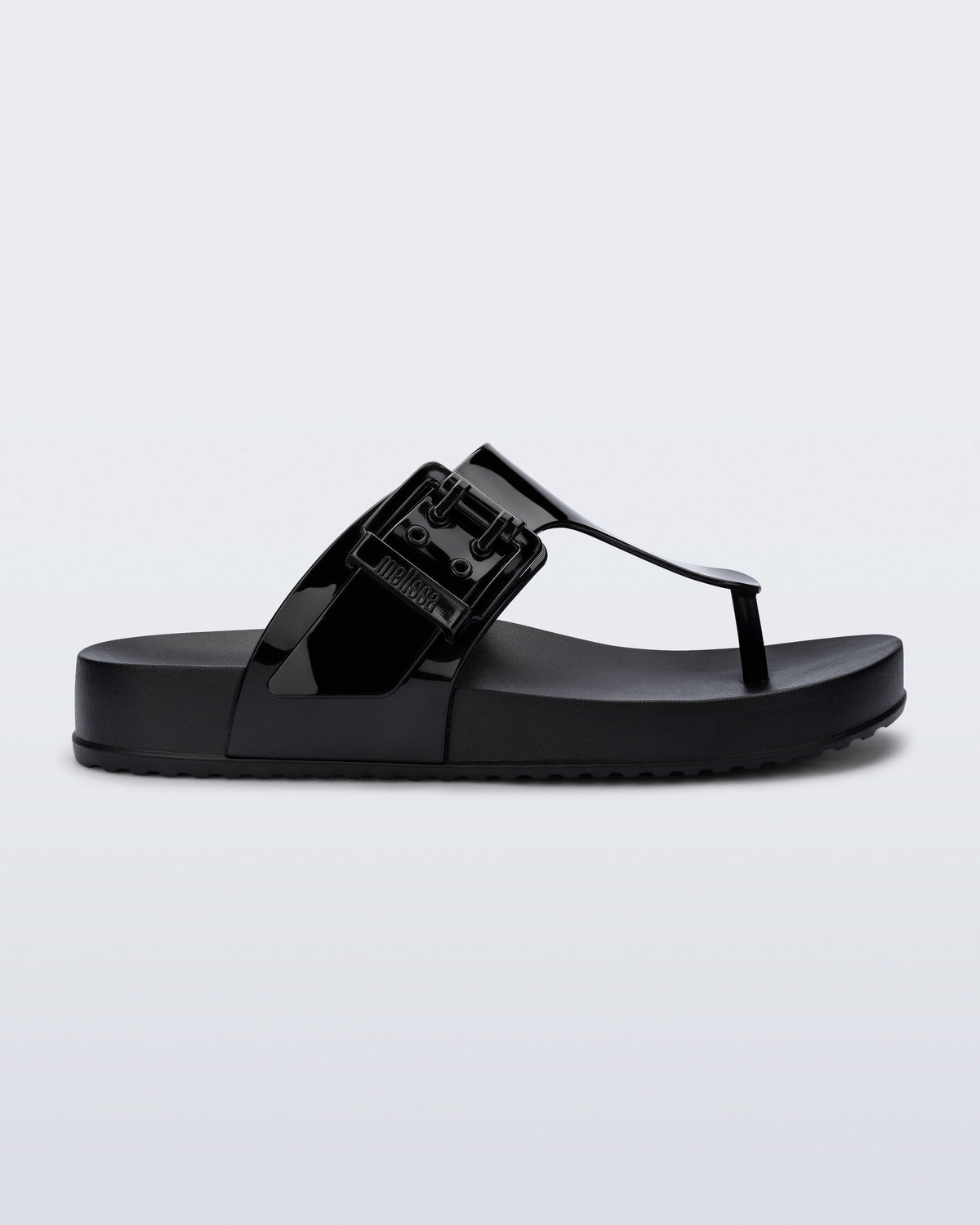 Side view of a black Cozy Flip flop