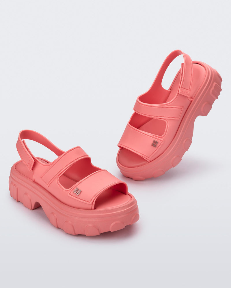 Angled view of a pair of pink Ella Move platform sandals.