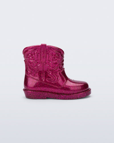 Side view of a glitter pink Texas baby boot