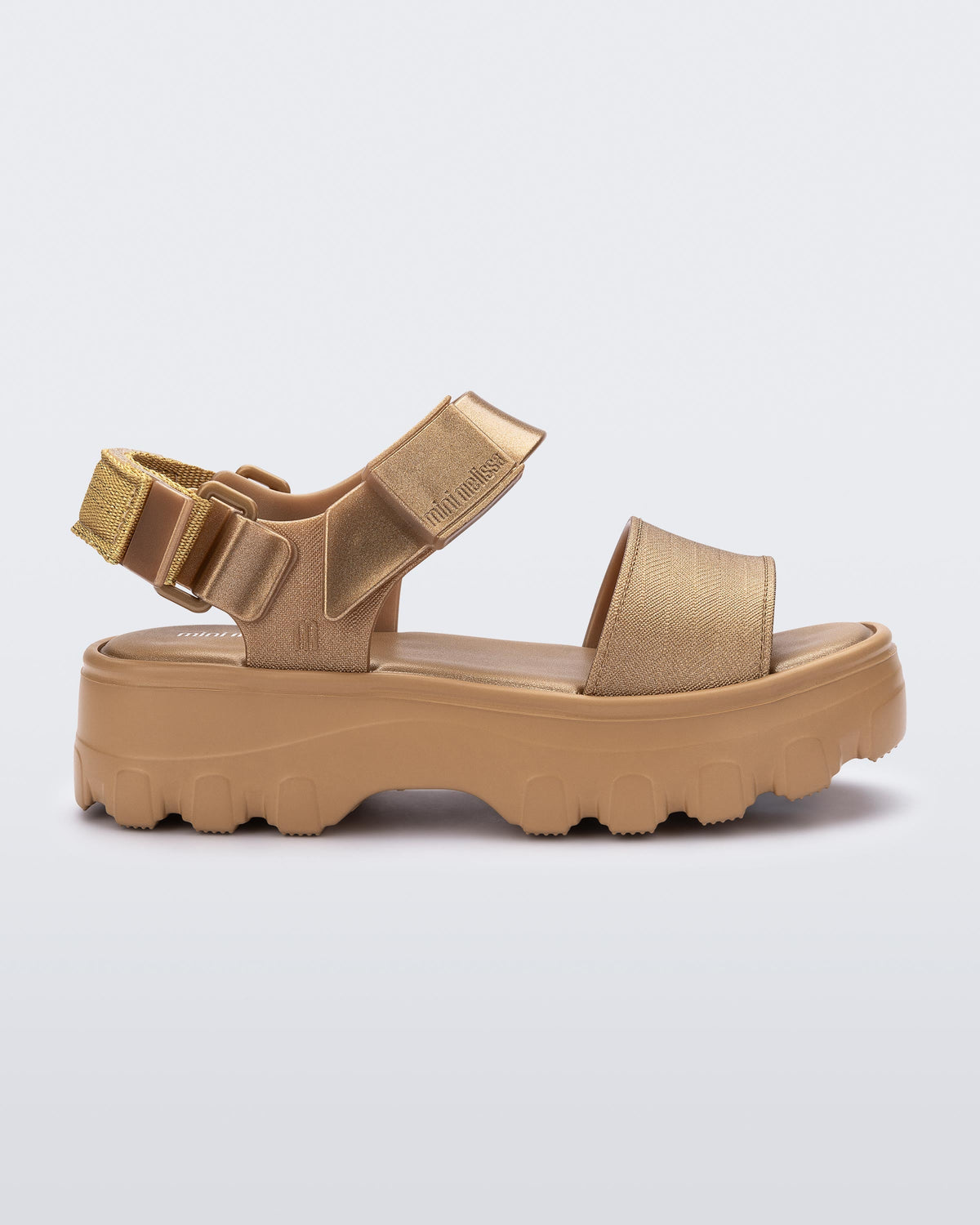 Side view of a gold kids Kick Off Sandal