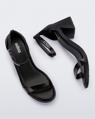 Top and side view of a pair of metallic black Lux Heels