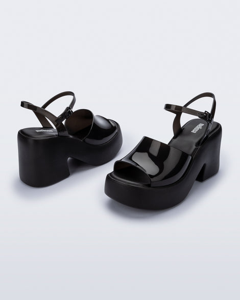 Angled view of a pair of black  Lina platform heels