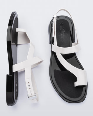 Top and side view of a pair of white Cassie sandals.
