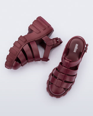 Side and top view of a pair of red Megan platform fisherman style adult sandal